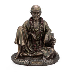 Resin Shirdi Sai Baba statue, seated figure with flower garlands and robe