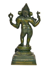 Brass Lord Ganesha statue, three-quarter front view, four arms holding objects