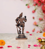 Copper Varaha carrying Lakshmi statue, side profile with raised weapon, 2.5 in