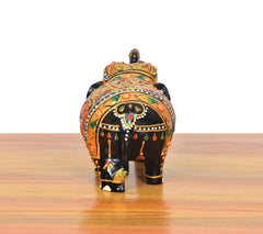 3-inch wooden elephant showpiece, rear view with multicolor patterned shell and painted tail