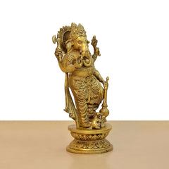 Brass Lord Ganesha idol, three-quarter view with intricate jewelry and hands