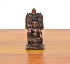 Copper Raghavendra Swami guru idol, seated figure with arched halo, front close-up.