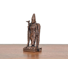 Copper Madurai Meenakshi idol, angled view showing arms and pedestal base