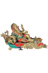 Bronze Ganesha figurine relaxing on peacock-style throne, colorful accents
