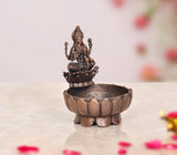 Copper Lakshmi Maa urli bowl, 3-inch height, dark copper lotus dish with goddess figure.