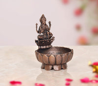 Copper Lakshmi Maa urli bowl, 3-inch height, dark copper lotus dish with goddess figure.