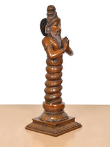 Brass Maharishi Patanjali statue, three-quarter side view, raised topknot