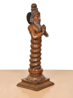 Brass Maharishi Patanjali statue, three-quarter side view, raised topknot