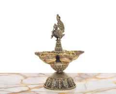 Brass diya stand with peacock figure, five shallow bowls on fluted pedestal