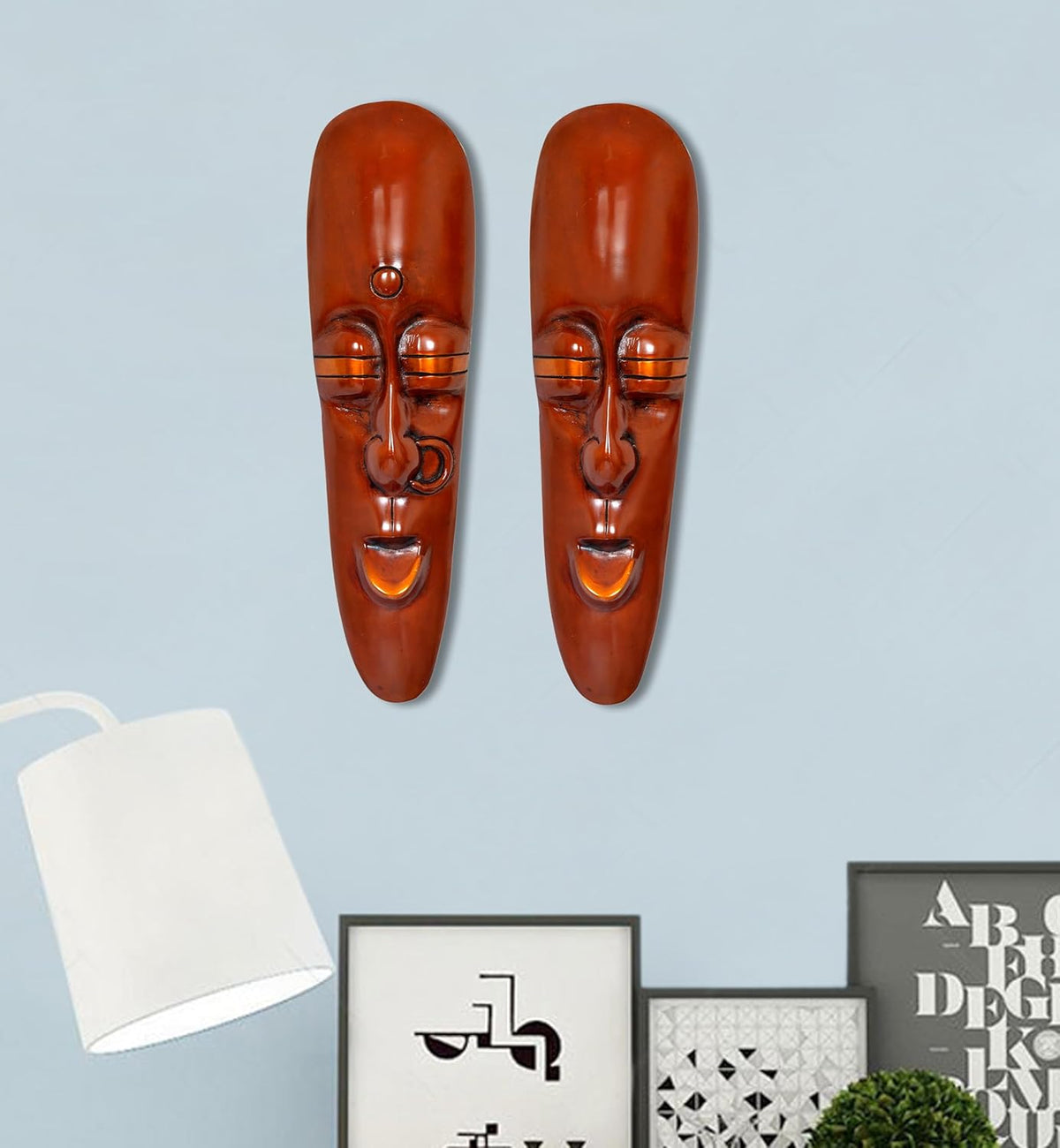 Set of 2 tribal face wall hangings with male and female faces, copper-brown finish