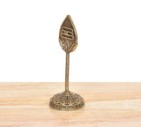 Bronze Lord Karttikeya Murugan vel on pedestal base; side view of engraved emblem