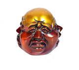 Buddha showpiece face, eyes and mouth detail, gold-and-red metallic finish
