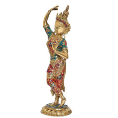 Side view of dancing Tara Devi statue, teal, red, and blue jeweled dress details