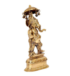 Brass Ganesha holding umbrella showpiece, standing side angle with round ornamental base