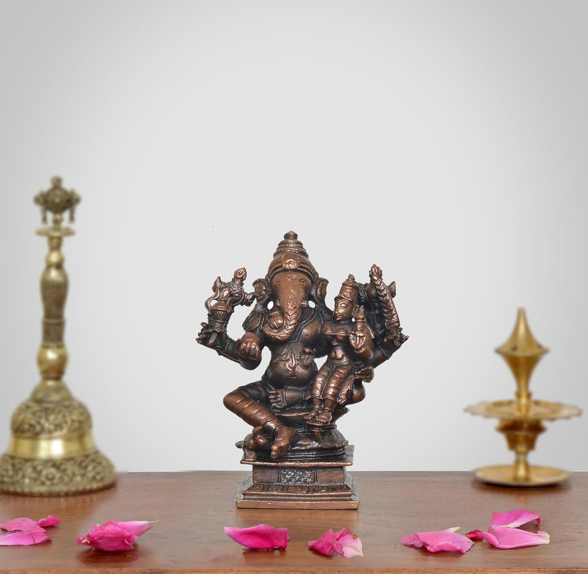 AONA copper Lord Ganesha idol seated with Riddhi, 4.5 in tall, multi-armed figure