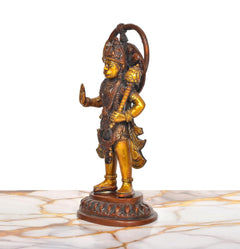 Brass Hanuman Ji statue side profile, arch of halo-like frame, gold highlights
