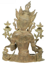Brass Tara Devi seated sculpture from behind, tall halo and carved back pattern