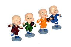 Resin kungfu monk figurines set: maroon, green, orange, blue statues with raised fists