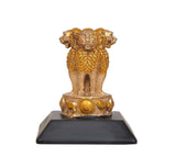 Gold-toned lion resin figurine standing on a dark rectangular base