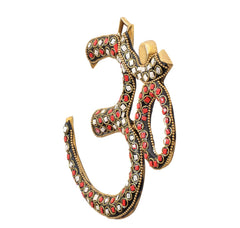 Gold-tone OM wall sculpture with red and silver gem inlay accents