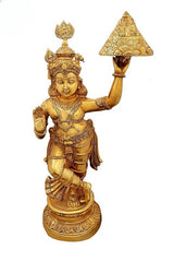 Brass Krishna statue lifting Govardhana mountain on raised hand, ornate crown and jewelry