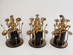 Brass Lakshmi, Ganesha, Saraswati statues with lotus stems on black bases
