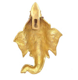 Brass Ganesha head wall hanging, back view showing smooth gold-toned plate