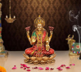 Lakshmi resin figurine seated on a lotus, multicolored attire and gold crown