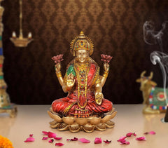 Lakshmi resin figurine seated on a lotus, multicolored attire and gold crown