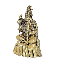 Brass goddess Rajarajeshwari idol, gold tone in side view seated with headdress and arm ornaments