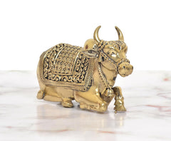 Bronze Nandi seated statue, side view showing legs and ornate back panel