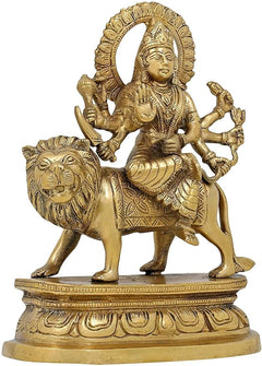 Brass Durga statue riding lion, detailed jewelry, weapons in extended hands