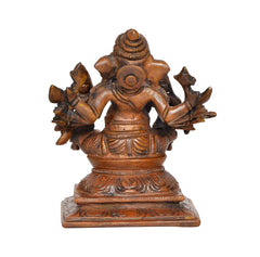 Brass Ganesha idol with Riddhi and Siddhi, back view with raised multi-armed design