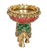 Brass elephant urli stand, gold bowl on chain rim, red green jeweled garland