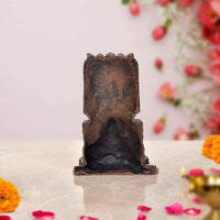 Copper Raghavendra Swami statue back view, ornate top panel and textured finish