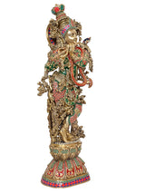 Brass Krishna sculpture, three-quarter view with raised arms and jeweled crown