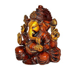 Side view of Ganesha idol on lotus, gold face and red-brown textured detailing
