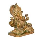 Brass Ganesha idol in side view, four hands and patterned dhoti on pedestal