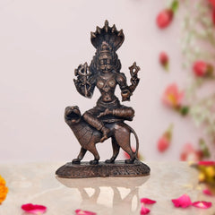 Pratyangira Devi copper statue seated on ornate base, trident and raised hands