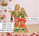 Brass Radha-Krishna idol on green base, multicolor garments and gold details
