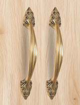 Golden brass main door pull pair with decorative bottom escutcheon and round details