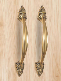 Golden brass main door pull pair with decorative bottom escutcheon and round details