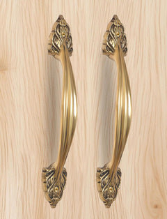 Golden brass main door pull pair with decorative bottom escutcheon and round details