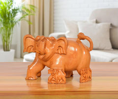 4-inch wooden elephant showpiece with carved mini elephants, orange-brown finish