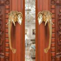 Brass Ganesha face door handle pair, two handles with elephant-head motifs, golden finish