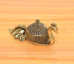 Brass duck kumkum box showpiece with black patterned dome lid and detailed duck tail