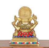 Back view of brass Ganesha idol, multicolour belt and beaded necklace