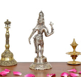 Brass Ardhanarishvara statue, side view with trident raised and carved round base
