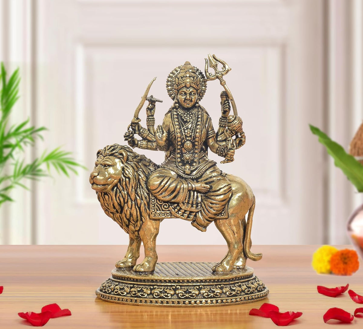 3-inch brass Durga Maa idol seated on a lion, raised arms and ornate jewelry