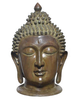 Brass Buddha head statue, front view with engraved smile, urna mark, and spiked hair